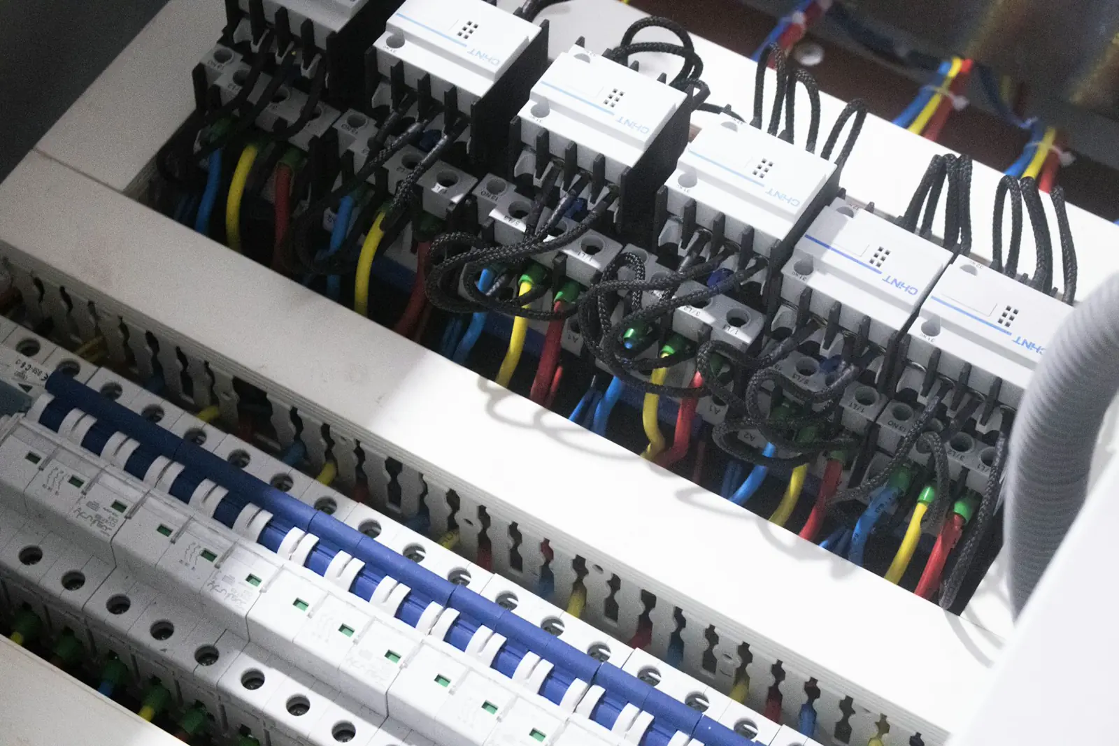 Illustrative photo of coloured wires in a switch box. Not an A1 Electricians job.